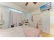 Bedroom featuring laminate floors, a large closet, and television at 23136 Langdon Ave, Port Charlotte, FL 33954