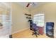 Well-lit office space with French doors, ceiling fan and ample desk space at 23136 Langdon Ave, Port Charlotte, FL 33954
