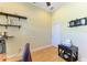 Home office with shelves, built-in lighting, ceiling fan and modern decor at 23136 Langdon Ave, Port Charlotte, FL 33954