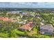 Aerial view of the neighborhood showcasing the lush landscaping and lake views at 2518 Dick Wilson Dr, Sarasota, FL 34240
