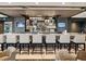 Beautiful bar with a granite countertop, display shelving, and comfortable seating at 2518 Dick Wilson Dr, Sarasota, FL 34240