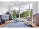 Bright bedroom with a unique bunk bed with a slide, large window, and an accent rug at 2518 Dick Wilson Dr, Sarasota, FL 34240