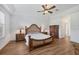 Primary bedroom suite boasts a decorative ceiling fan, and large windows allowing for plenty of natural light at 2518 Dick Wilson Dr, Sarasota, FL 34240
