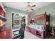 room with a bunk bed that overlooks the pool is a cozy and fun space to sleep and relax in at 2518 Dick Wilson Dr, Sarasota, FL 34240
