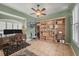 Bright bedroom with a vintage wood desk and wall unit, featuring hardwood bookshelves at 2518 Dick Wilson Dr, Sarasota, FL 34240