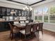 Elegant dining room with wood floors, modern lighting, and stylish furnishings at 2518 Dick Wilson Dr, Sarasota, FL 34240