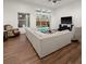 Spacious living room with a view to the pool, fan and recessed lighting at 2518 Dick Wilson Dr, Sarasota, FL 34240