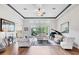 Spacious living room with wood floors, high ceilings, and a grand piano at 2518 Dick Wilson Dr, Sarasota, FL 34240