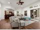 Open-concept living room seamlessly flows into the kitchen, offering a modern and airy design at 2518 Dick Wilson Dr, Sarasota, FL 34240