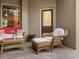 Cozy outdoor seating area with wicker furniture and view of the lush backyard at 2518 Dick Wilson Dr, Sarasota, FL 34240