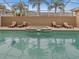 Enjoy the sparkling pool surrounded by lounge chairs in a private, screened-in lanai at 2518 Dick Wilson Dr, Sarasota, FL 34240