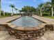 Attractive water feature and landscaping located at the community entrance at 2518 Dick Wilson Dr, Sarasota, FL 34240