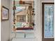 Sunroom window nook with views of the pool, decorative glass and shelves at 2518 Dick Wilson Dr, Sarasota, FL 34240