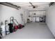 Spacious garage with painted floor and walls, laundry appliances, and ample room for storage and equipment at 3167 Pinetree St, Port Charlotte, FL 33952
