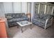 Sunroom with tile floors, wicker furniture and a glass coffee table at 3167 Pinetree St, Port Charlotte, FL 33952