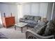 Sunroom with wicker furniture, tile floors, and plenty of natural light at 3167 Pinetree St, Port Charlotte, FL 33952