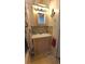 Bathroom features nautical-themed decorations, vanity with cabinet, and ceramic tile flooring at 3333 26Th E Ave # 1023, Bradenton, FL 34208
