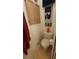 Bathroom features a toilet, storage cabinet, and nautical decorations at 3333 26Th E Ave # 1023, Bradenton, FL 34208