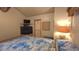 This bedroom offers a TV and decorative bedside lamp at 3333 26Th E Ave # 1023, Bradenton, FL 34208