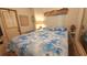 Comfortable bedroom features a queen bed with a decorative blue and white patterned comforter at 3333 26Th E Ave # 1023, Bradenton, FL 34208