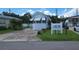 Inviting single-story home with a well-kept lawn and a neatly paved driveway on a sunny day at 3333 26Th E Ave # 1023, Bradenton, FL 34208