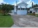 Charming single-story home featuring a well-maintained lawn, concrete driveway, and stylish awnings at 3333 26Th E Ave # 1023, Bradenton, FL 34208
