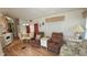 Cozy living room with comfortable seating, dining area and abundant natural light, perfect for relaxation and entertaining at 3333 26Th E Ave # 1023, Bradenton, FL 34208