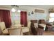 Comfortable living space with dining area, plush seating, and ample natural light, ideal for relaxation and social gatherings at 3333 26Th E Ave # 1023, Bradenton, FL 34208