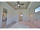 Bedroom showcasing elegant tray ceilings, a modern ceiling fan, and natural light at 350 Bucknell Rd, Venice, FL 34293