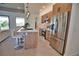 Modern kitchen with island seating, stainless steel appliances, and sleek wooden cabinetry at 350 Bucknell Rd, Venice, FL 34293