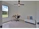 Home office with natural light, minimalist furnishings and serene outdoor view at 350 Bucknell Rd, Venice, FL 34293