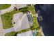 Birds-eye view of home, pool, boat lift and canal in residential neighborhood at 3615 Tripoli Blvd, Punta Gorda, FL 33950