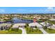Aerial of waterfront homes showcasing the neighborhood's enviable location on the waterway at 3615 Tripoli Blvd, Punta Gorda, FL 33950