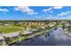 Aerial view of canal-front homes boasting private docks, screened enclosures, and meticulously maintained landscaping at 3615 Tripoli Blvd, Punta Gorda, FL 33950