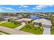 Aerial view of the home and community showcasing well-manicured lawns and direct water access canals at 3615 Tripoli Blvd, Punta Gorda, FL 33950