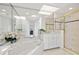 The bathroom features a soaking tub with shower and double sink vanities with great lighting at 3615 Tripoli Blvd, Punta Gorda, FL 33950