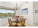 Charming breakfast nook offers views of the pool and the waterfront through large windows at 3615 Tripoli Blvd, Punta Gorda, FL 33950