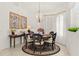 Elegant dining room featuring a decorative rug, light fixture, and neutral decor at 3615 Tripoli Blvd, Punta Gorda, FL 33950