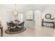 Dining room showcasing a decorative rug, modern chandelier, and refined neutral color scheme at 3615 Tripoli Blvd, Punta Gorda, FL 33950
