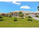 Charming single-story home with lush green lawn and meticulously landscaped front yard at 3615 Tripoli Blvd, Punta Gorda, FL 33950