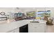 Open concept living space boasts waterfront views and flows seamlessly from kitchen to living area at 3615 Tripoli Blvd, Punta Gorda, FL 33950