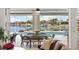 Waterfront patio with screened enclosure, pool, and outdoor dining set at 3615 Tripoli Blvd, Punta Gorda, FL 33950