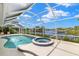 Beautiful waterfront pool and jacuzzi surrounded by a screened enclosure at 3615 Tripoli Blvd, Punta Gorda, FL 33950