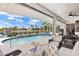 Stunning waterfront pool with screened enclosure and comfortable patio seating at 3615 Tripoli Blvd, Punta Gorda, FL 33950