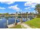 Waterfront property featuring a private dock and boat lift, perfect for enjoying waterfront living at 3615 Tripoli Blvd, Punta Gorda, FL 33950