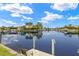 Scenic waterfront with private boat dock, perfect for boating and enjoying picturesque water views at 3615 Tripoli Blvd, Punta Gorda, FL 33950
