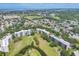 Aerial view of the property, golf course, and pond at 3640 Ironwood Cir # 302N, Bradenton, FL 34209