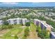 Aerial view of property, golf course, and surrounding neighborhood at 3640 Ironwood Cir # 302N, Bradenton, FL 34209