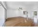 Open living room with hardwood floors and access to the kitchen at 3640 Ironwood Cir # 302N, Bradenton, FL 34209