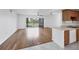 Spacious living room featuring hardwood floors and a sliding glass door at 3640 Ironwood Cir # 302N, Bradenton, FL 34209